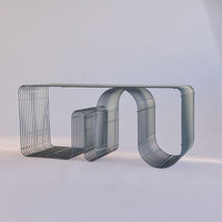 Sleek gray metal wire table with unique curved patterns, perfect for modern decor.
