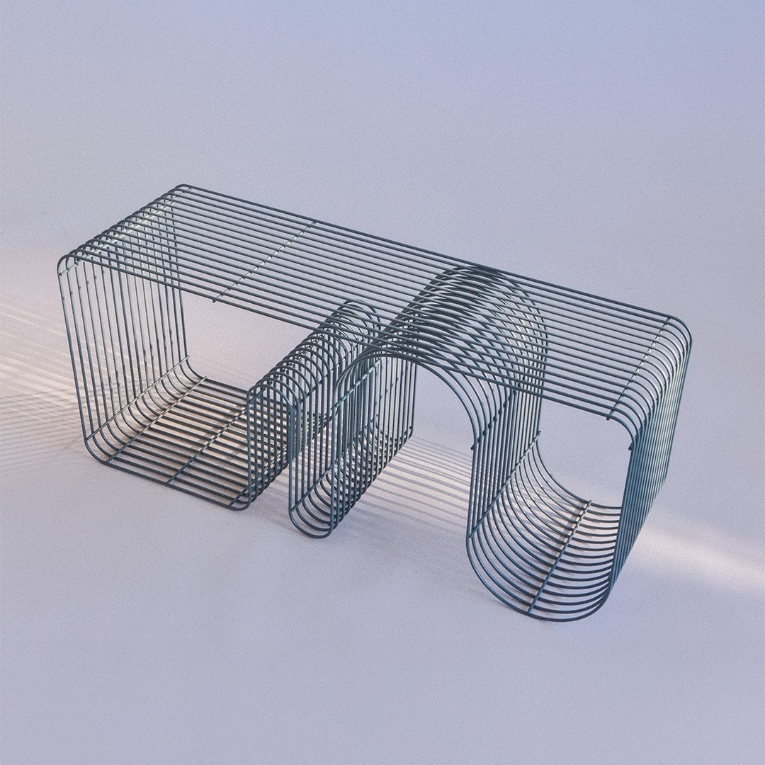 Stylish wire table in muted blue with geometric patterns and sleek lines, casting soft shadows.