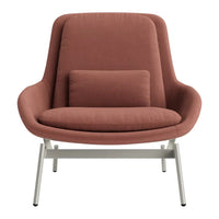 Warm terracotta, soft fabric upholstery, and sleek metal legs create a modern accent chair. Ideal for stylish interiors.