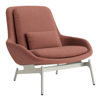Mid-century modern lounge chair in soft dusty rose fabric with clean lines and sleek white metal legs.