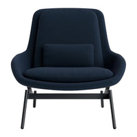 Navy blue armchair with a sleek, modern design and a matching lumbar pillow on a minimalist black base.