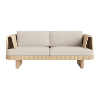 Beige upholstered sofa with textured, ribbed wooden base and sleek, modern design. Ideal for contemporary living spaces.