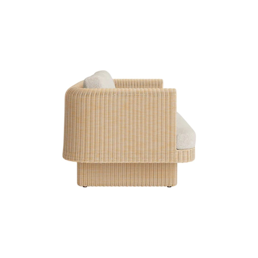 Beige ribbed fabric accent chair with light cream cushions, featuring a modern and textured pattern.