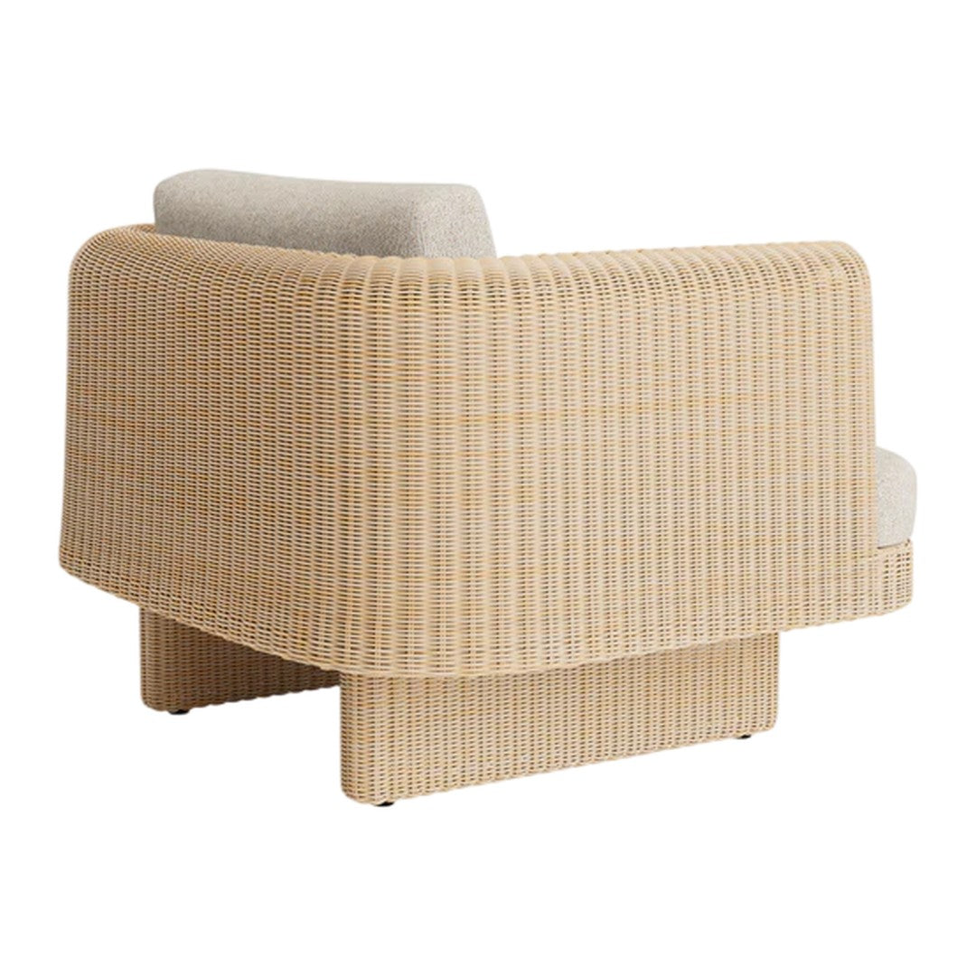 Beige ribbed fabric armchair with a soft light gray cushion, creating a modern and stylish aesthetic.