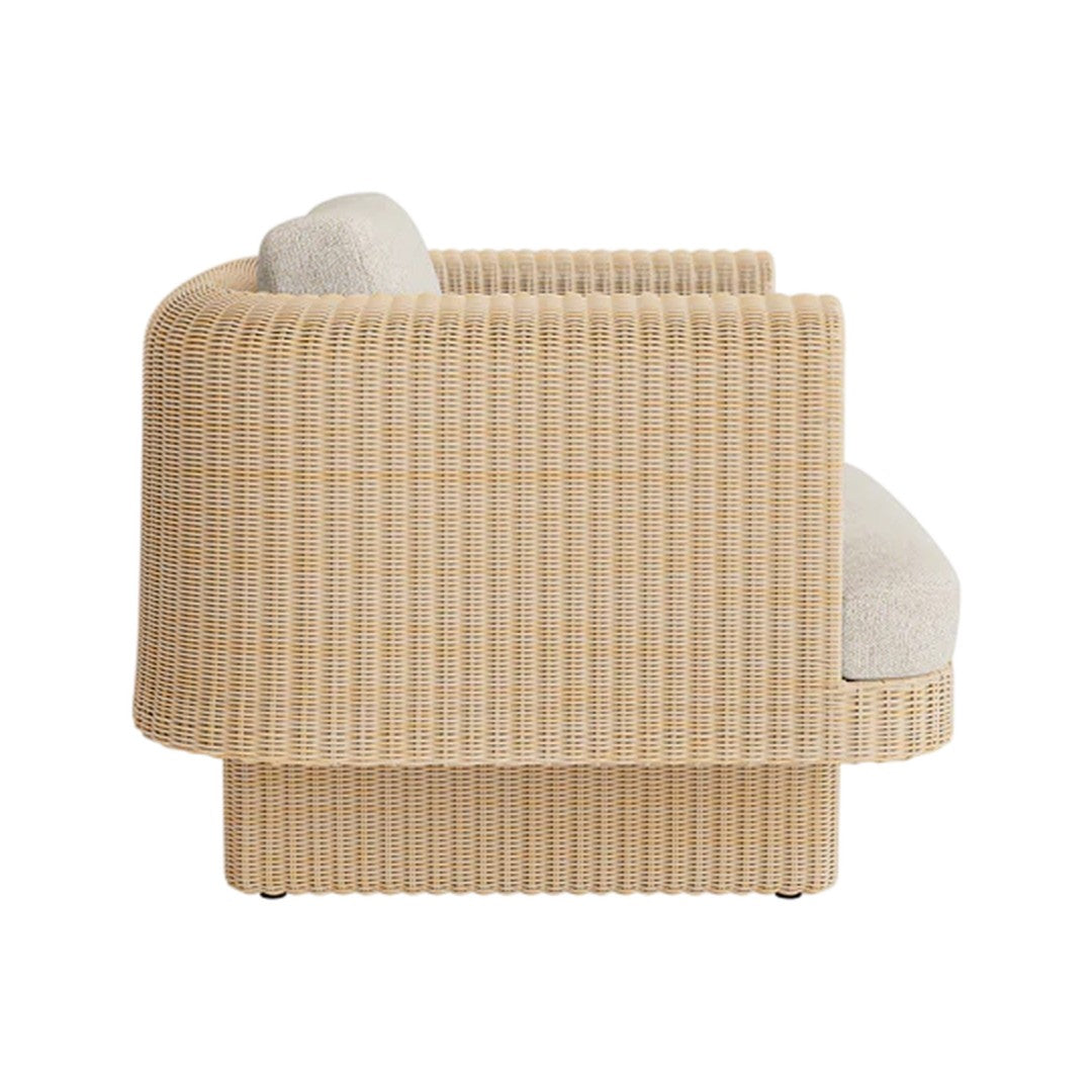 Beige ribbed fabric sofa with a smooth, light gray cushion and curved design. Perfect for modern interiors.