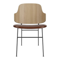 Modern chair with a light wood backrest and dark walnut seat, featuring a sleek black metal frame.