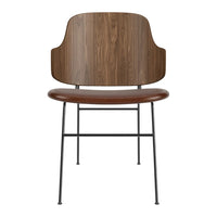 Modern chair featuring a sleek walnut wood backrest and warm brown seat, complemented by a minimalist black metal frame.