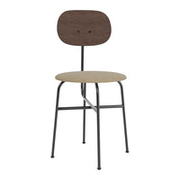 Brown wooden backrest and beige seat on sleek black metal frame chair. Modern minimalistic design.