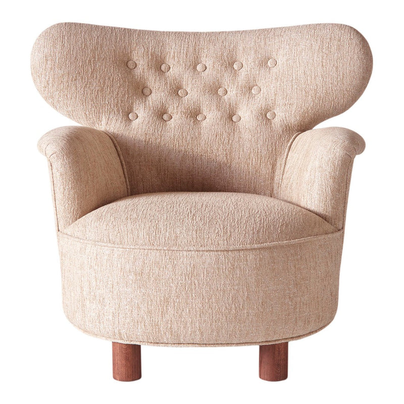 Tan upholstered chair with button tufting and a curvy butterfly shape, supported by wooden legs.