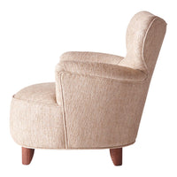 Beige textured fabric armchair with a curved silhouette and wooden legs. Ideal for modern and cozy interiors.