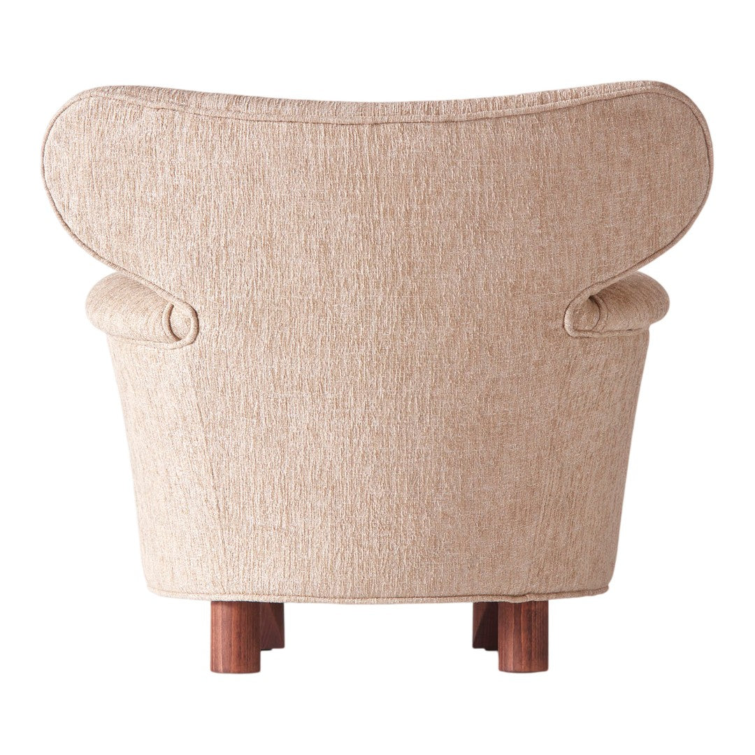 Beige textured fabric armchair with elegant curves and wooden legs, perfect for modern interiors.