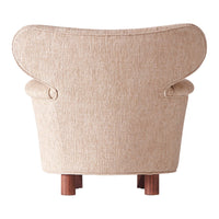 Beige textured fabric armchair with elegant curves and wooden legs, perfect for modern interiors.