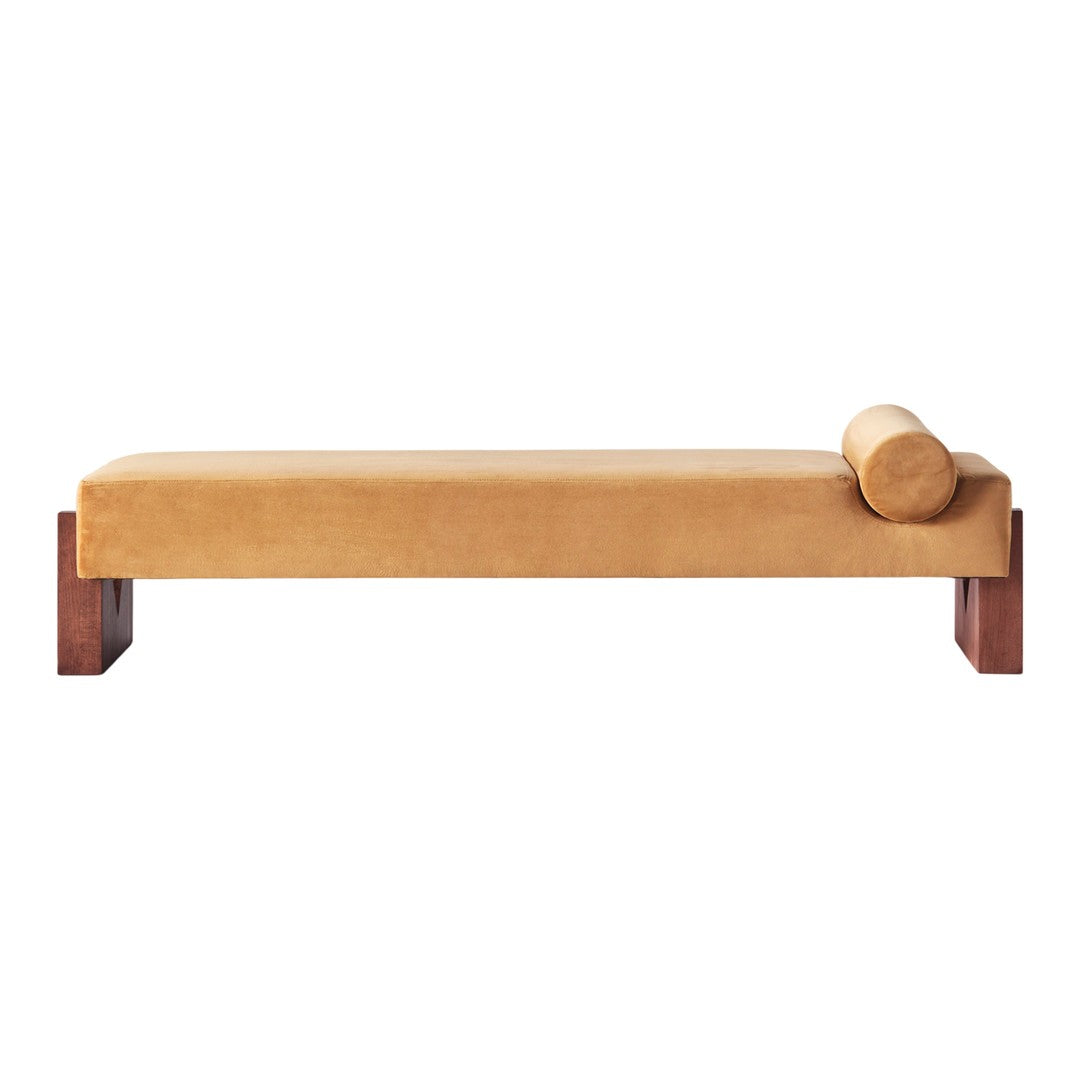 Minimalist mustard yellow daybed with a wooden base and a matching cylindrical cushion. Soft texture and sleek design.