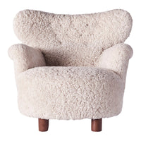 Cream-colored cozy chair with a textured, fluffy upholstery and stylish wooden legs. Perfect for modern decor.