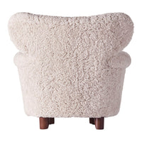 Light beige, textured fur upholstery with plush curves and dark wood legs. Soft, cozy design for modern interiors.