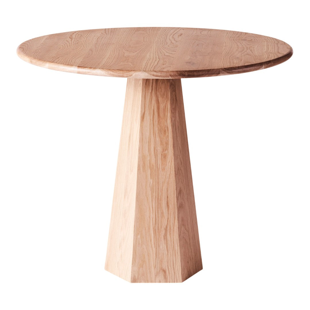 Round wooden table with a natural light oak finish and a smooth, seamless pattern. Ideal for modern décor.