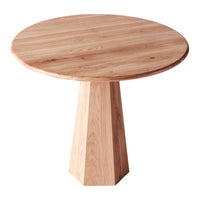 Light oak round table with a natural wood grain pattern and a geometric pedestal base in a soft beige tone.