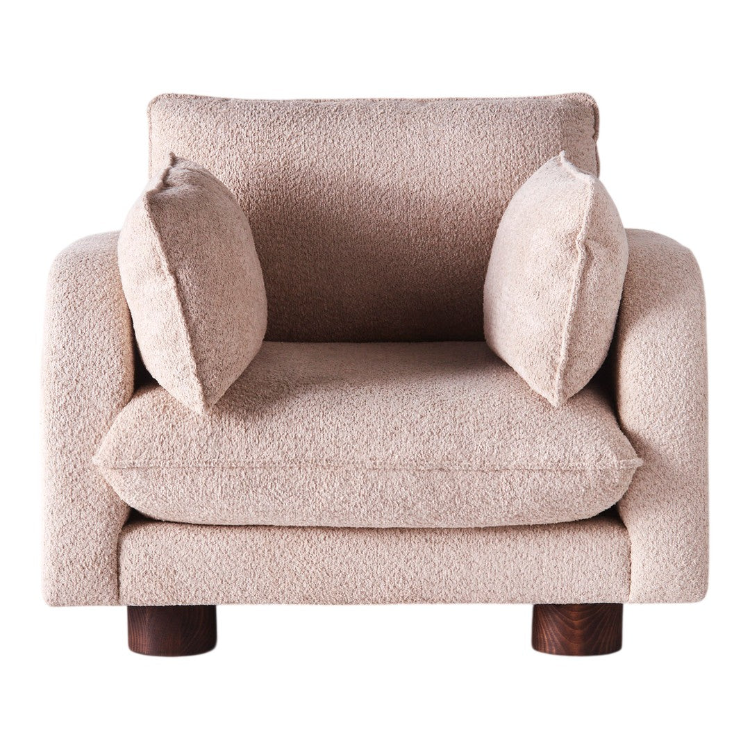 Beige textured armchair with two plush cushions and dark wooden legs. Cozy and minimalist design for modern interiors.