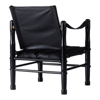 Black bamboo chair with a sleek leather seat, showcasing a minimalist design and modern aesthetic.