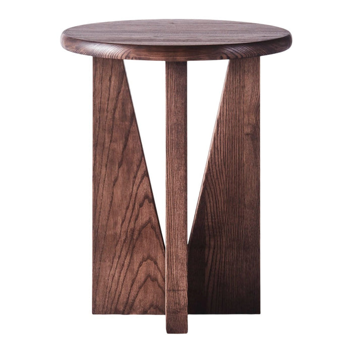 Dark wood round stool with a natural finish and angular geometric legs, showcasing rich graining and texture.