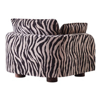 Zebra-patterned accent chair in black and cream, featuring a curvy design and wooden legs. Perfect for bold decor.