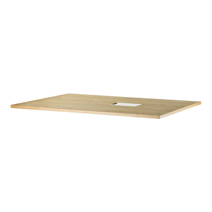 Light wood tabletop with a smooth, natural finish and subtle grain patterns, featuring a central cutout for cable management.