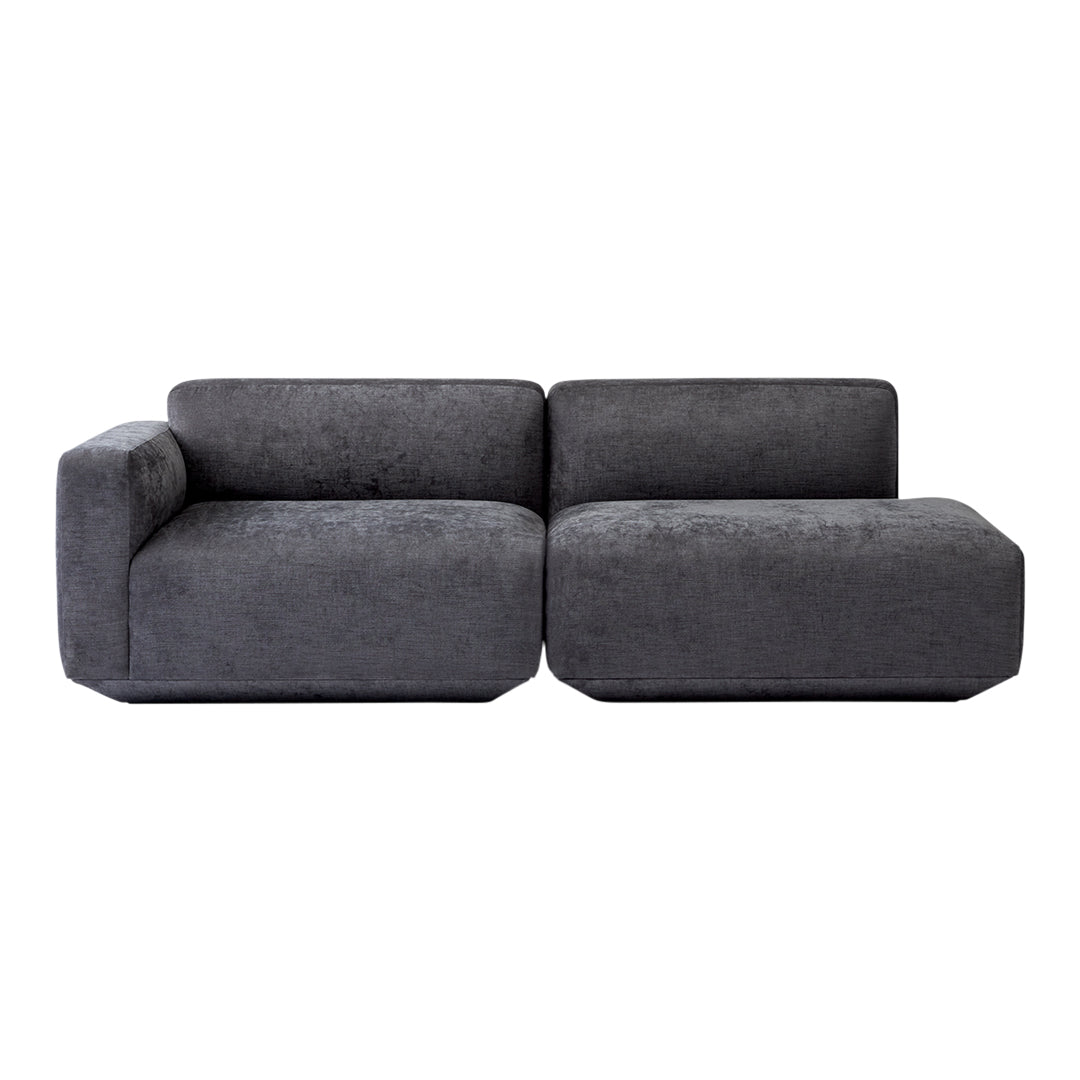 Gray upholstered sectional sofa with a modern, minimalist design and soft, textured finish.