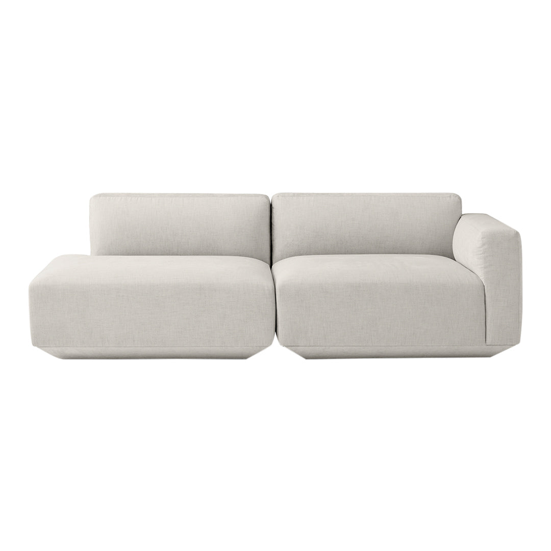 Cozy beige sectional sofa featuring a minimalist design with clean lines and a soft, textured fabric.