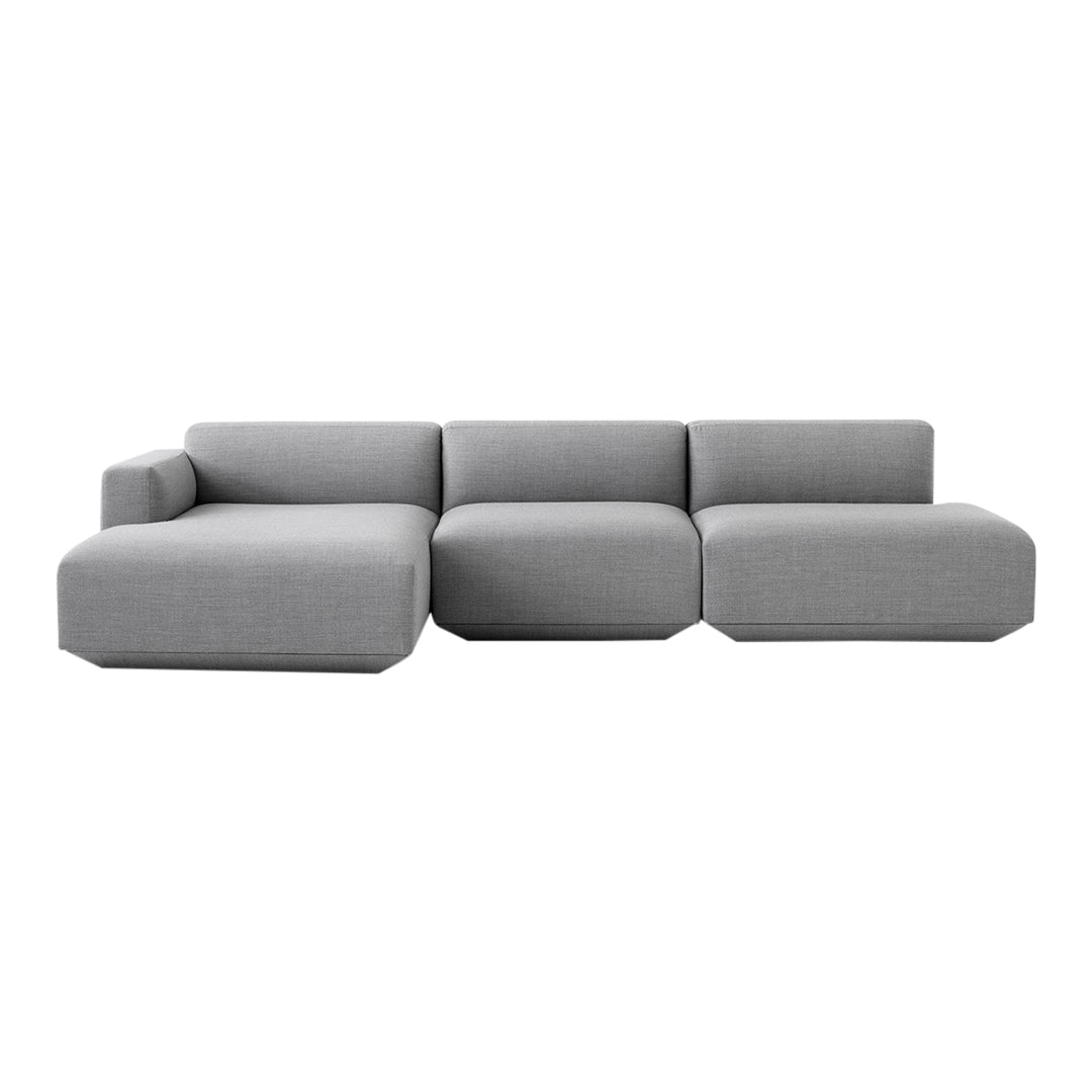 Modern gray sectional sofa with a sleek design and smooth, minimalist pattern. Perfect for contemporary living spaces.