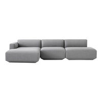 Modern gray sectional sofa with a sleek design and smooth, minimalist pattern. Perfect for contemporary living spaces.