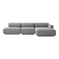 Modern gray sectional sofa with sleek geometric shapes and a minimalist design, perfect for contemporary living spaces.