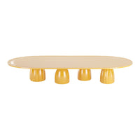 Oval yellow table with a smooth surface and rounded yellow legs, creating a cheerful, modern aesthetic.