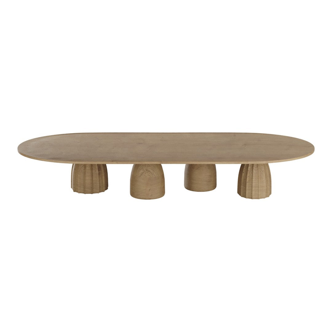 Oval beige coffee table with textured legs, featuring a smooth surface and minimalist design for modern decor.