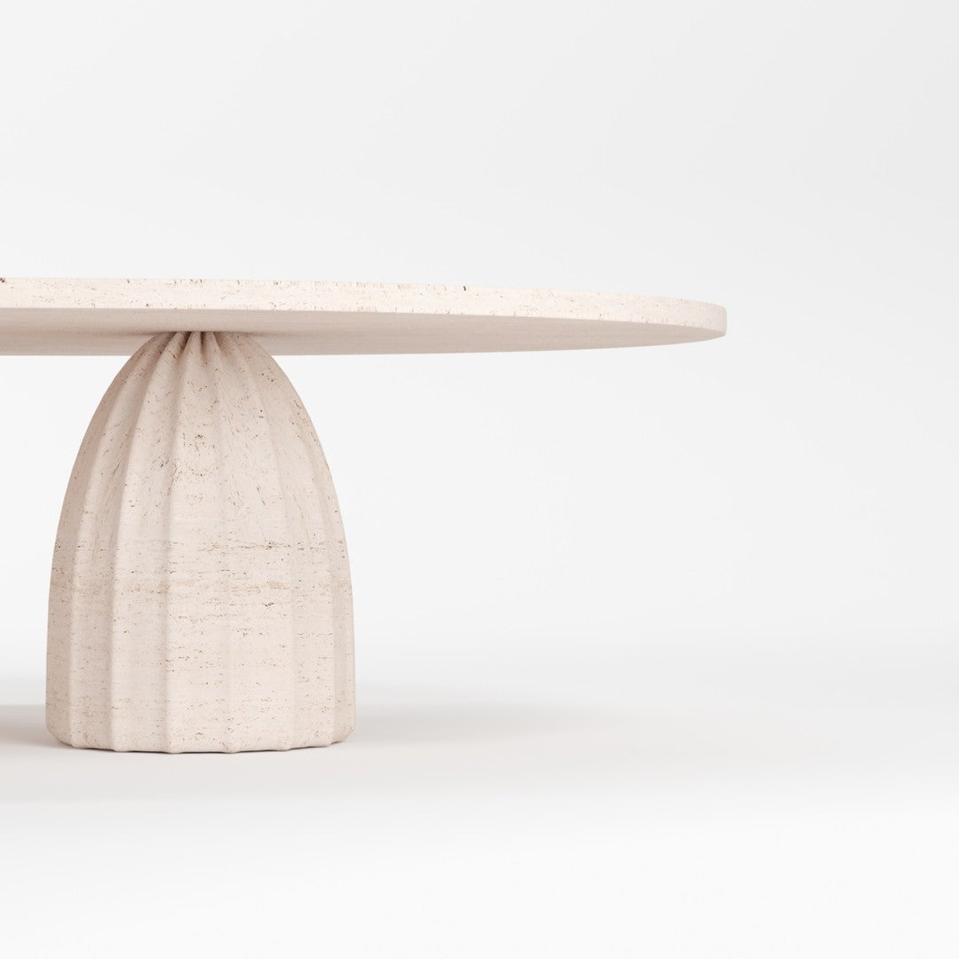 Round beige table with a textured base, featuring a smooth surface and minimalistic design against a plain white background.