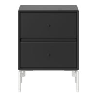 Sleek black nightstand with minimalist white legs and smooth, matte finish. Perfect for modern decor.