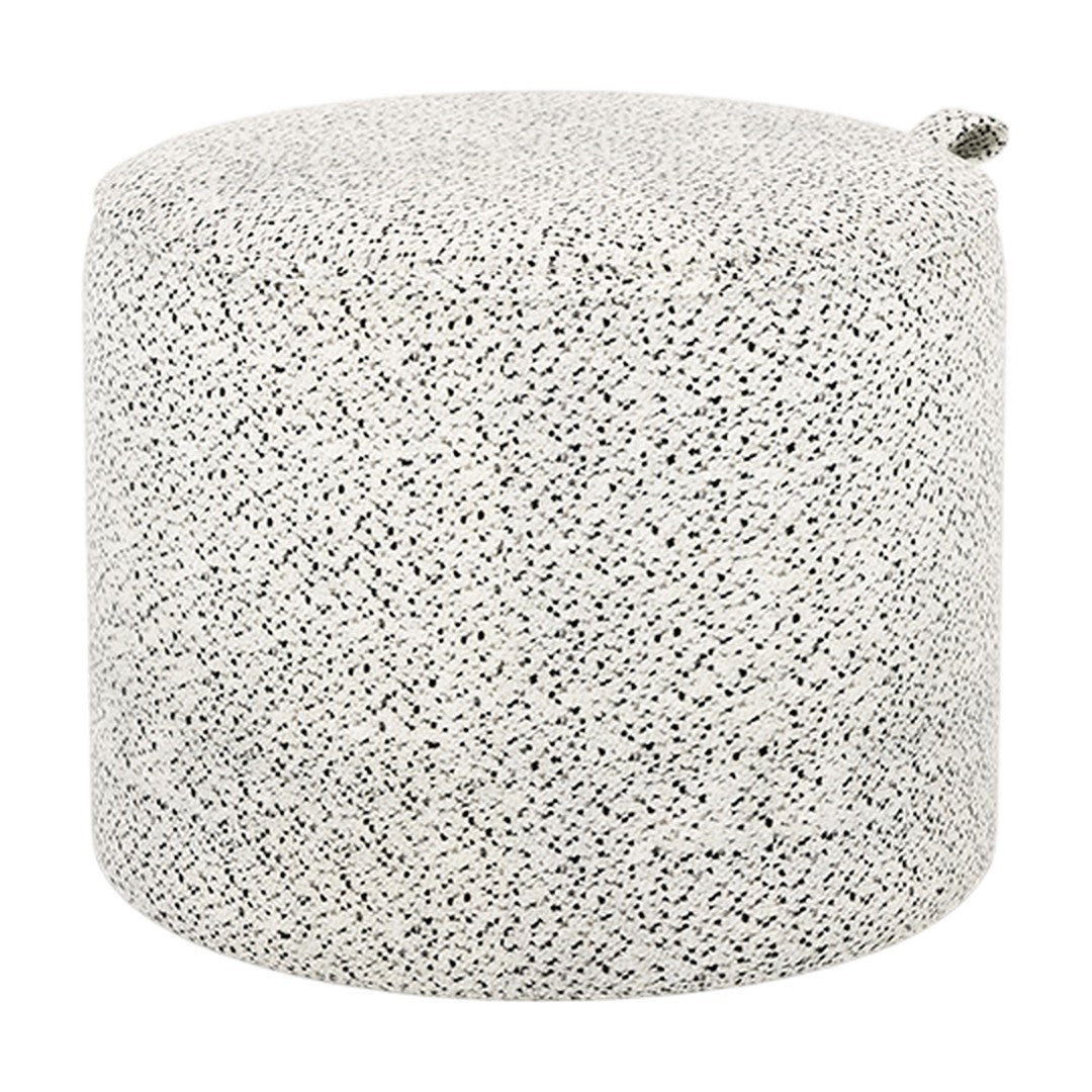 Round pouf in a textured black-and-white speckled pattern, ideal for modern decor. Fabric finish adds a stylish touch.