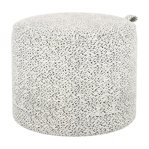 Round pouf in a textured black-and-white speckled pattern, ideal for modern decor. Fabric finish adds a stylish touch.