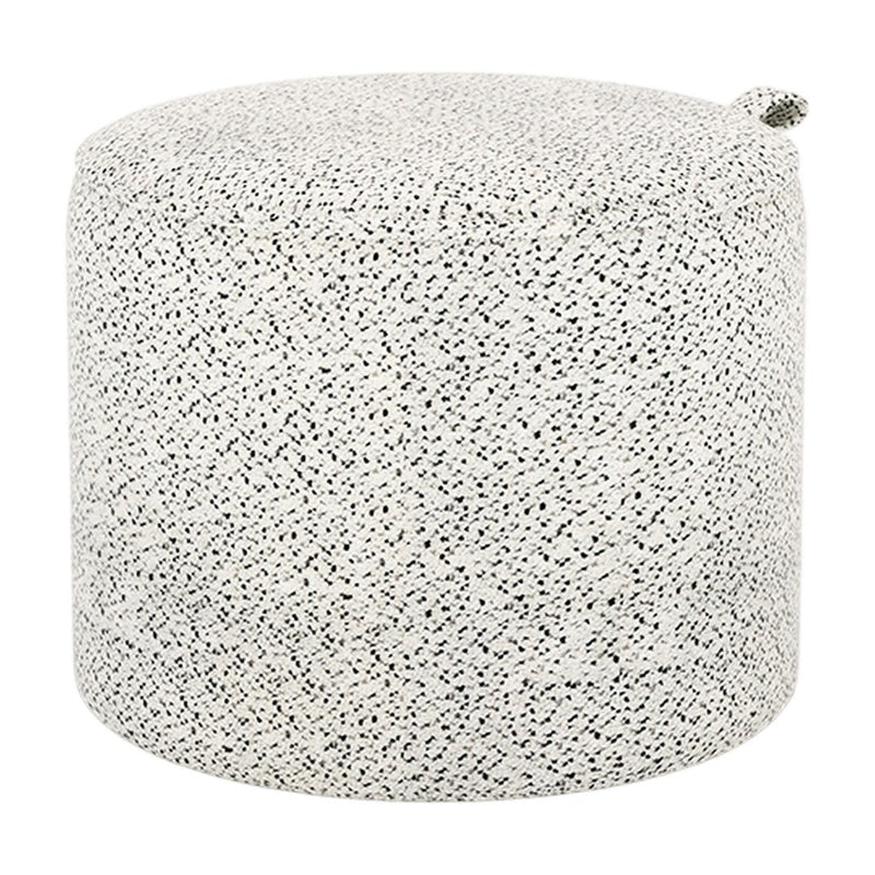 Round pouf in a textured black-and-white speckled pattern, ideal for modern decor. Fabric finish adds a stylish touch.