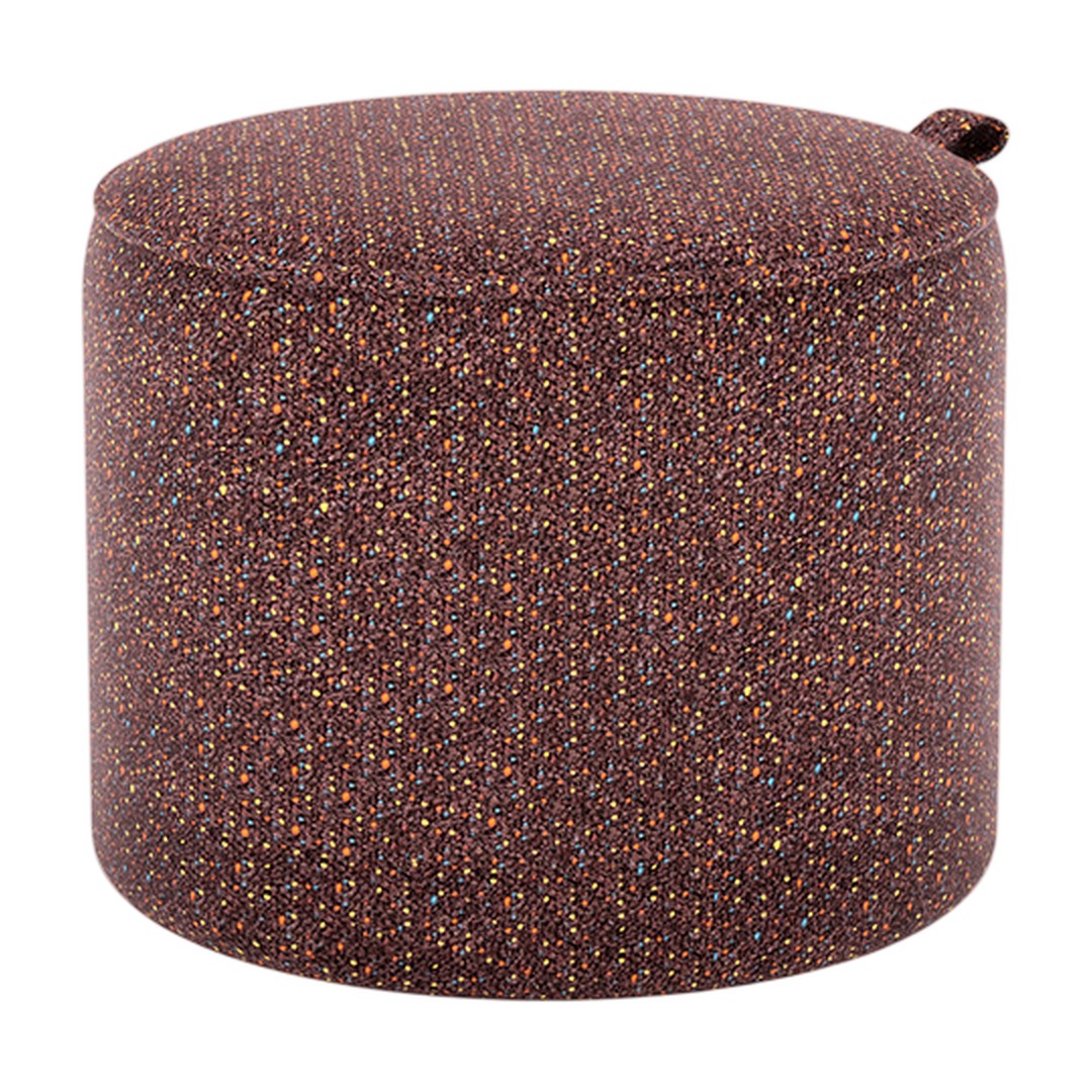 Round ottoman in rich brown with vibrant multicolor specks, adding a stylish touch to any space.