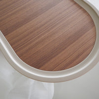Light brown wood grain tabletop with subtle linear patterns and a smooth cream-colored edge.