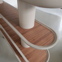 Light beige and warm brown wood grain patterns on a sleek, modern shelf with rounded edges.