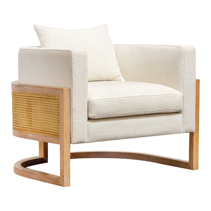 Cream upholstered armchair with a wood frame and woven rattan side panel for a modern, stylish touch.