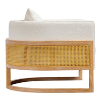 "Round cream upholstered chair with natural rattan and light wood base, featuring a smooth, minimalist design."