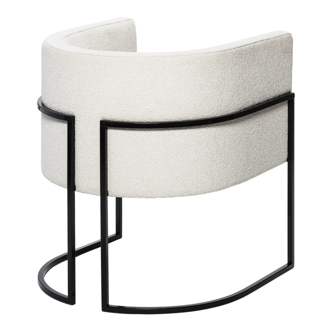 White curved chair with textured upholstery and sleek black metal frame, perfect for modern decor.