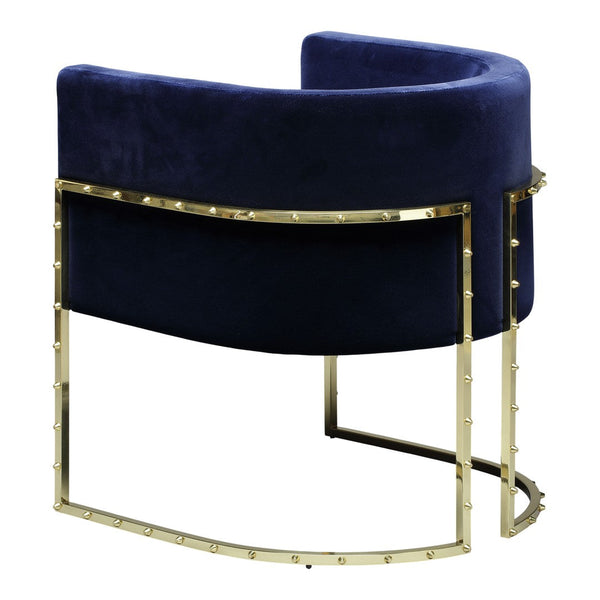 Luxurious navy velvet chair with a sleek gold metal base and studded detailing, offering modern elegance.