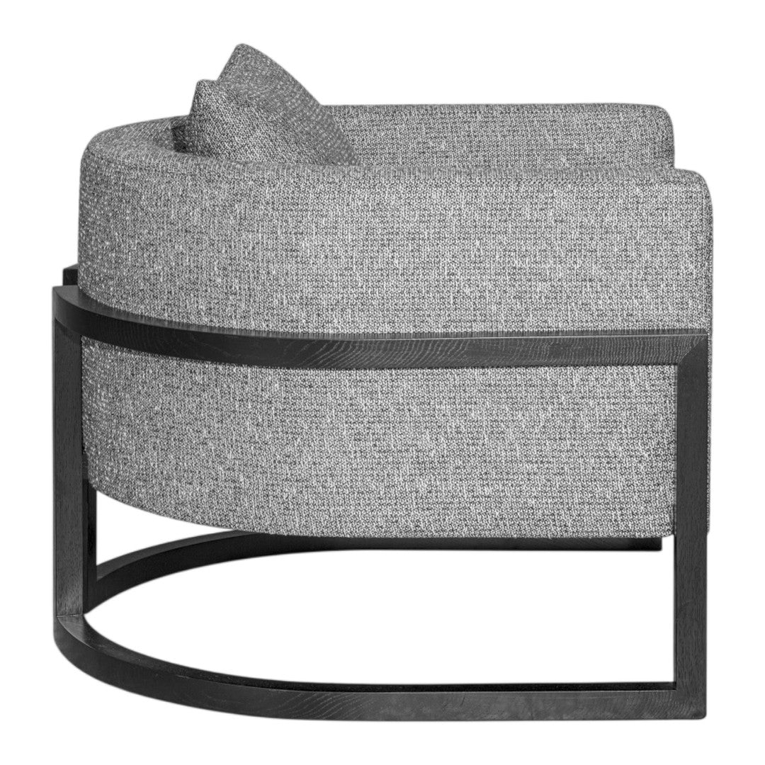 Curved gray fabric chair with a textured pattern and sleek black metal frame. Perfect for modern decor.