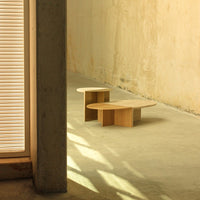 Light wood coffee table set with soft rounded edges, complementing a minimalist interior design.