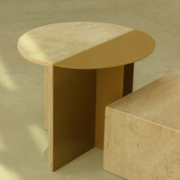Round beige and gold accent table with a sleek, modern two-tone design and smooth surfaces. Ideal for contemporary decor.