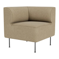 Beige corner chair with a smooth, textured fabric and black metal legs, perfect for modern living spaces.