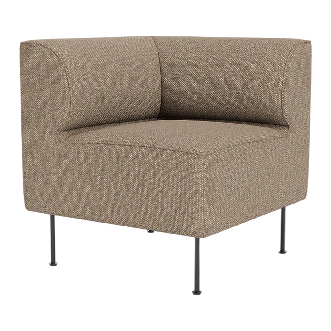 Tan upholstered corner chair with a textured pattern and slim black metal legs. Modern and minimalist design.